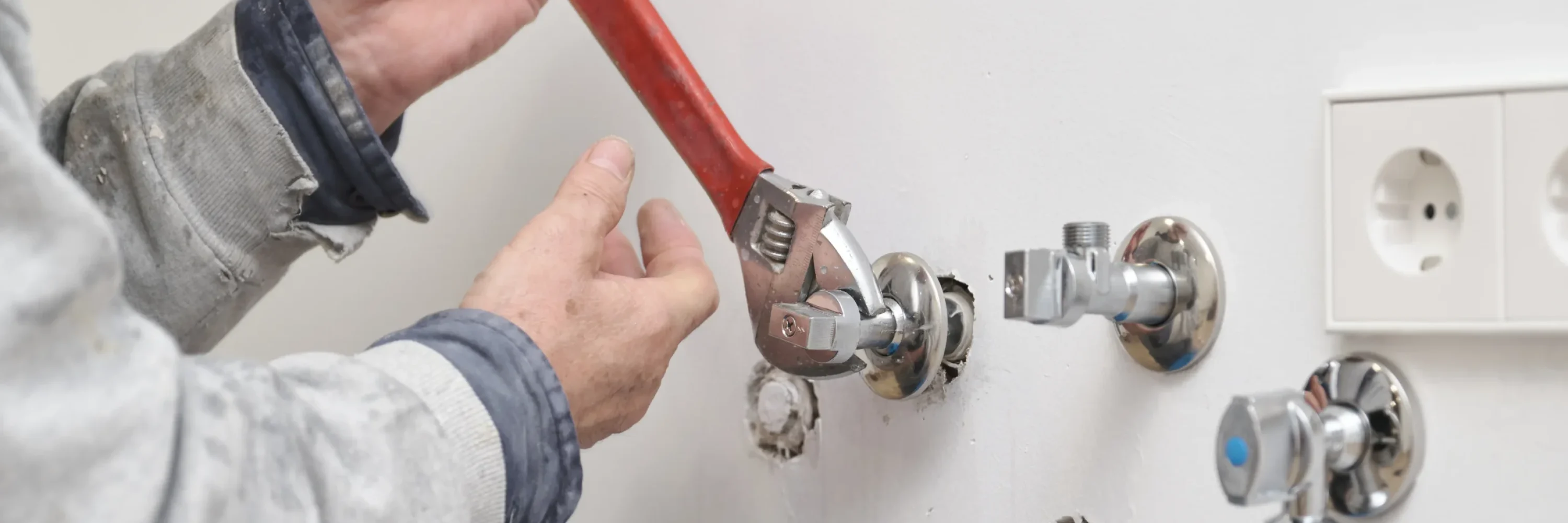 plumber-screwing-plumbing-fittings-with-an-adjusta-2025-03-14-07-31-28-utc